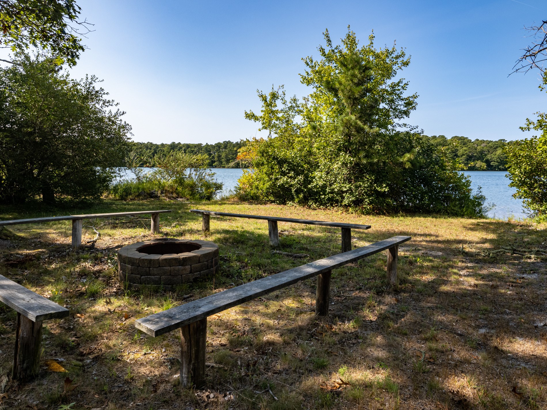 Benches around firepit and Long Pond